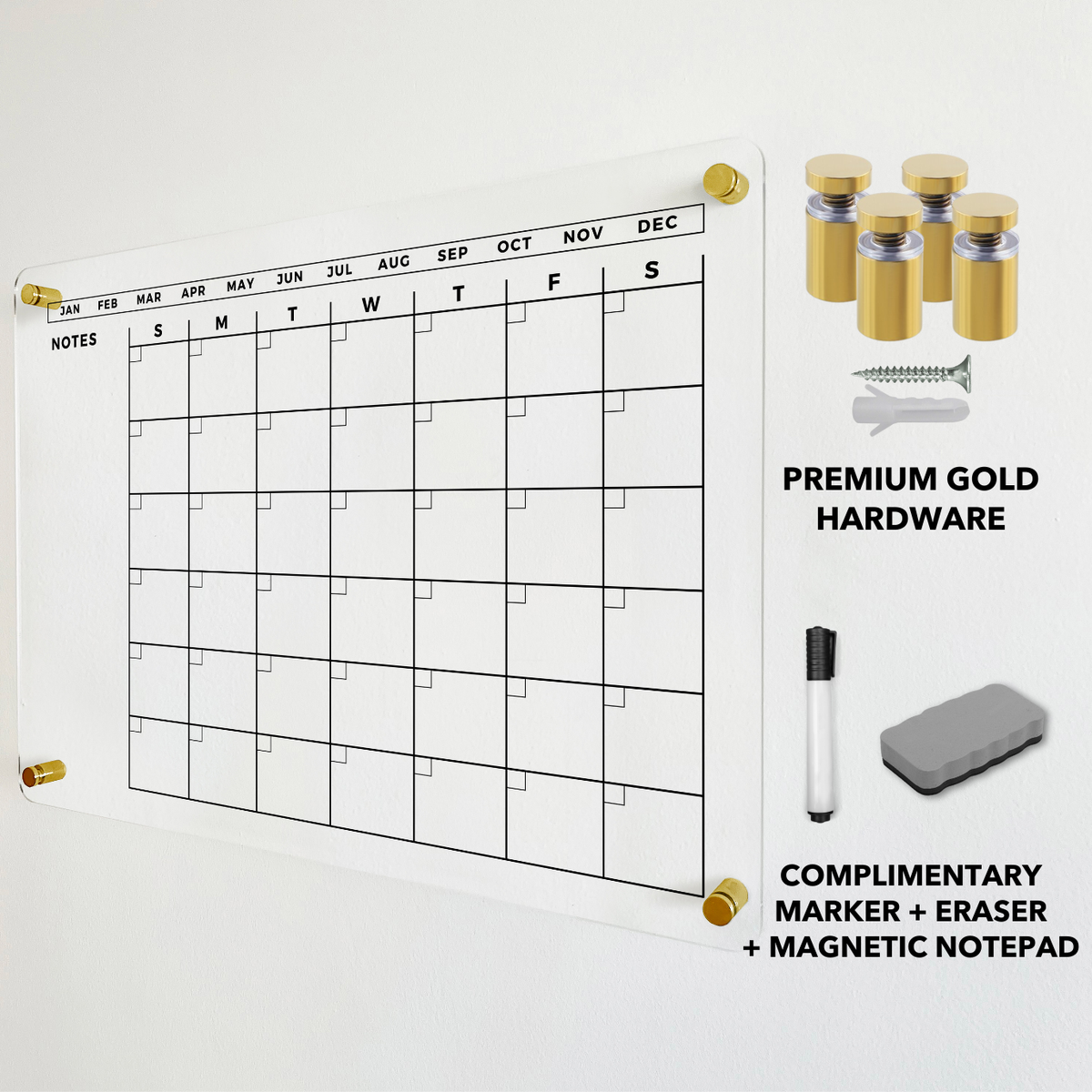 Acrylic monthly calendar with a left notes area, shown with gold wall mounts and a dry-erase eraser.