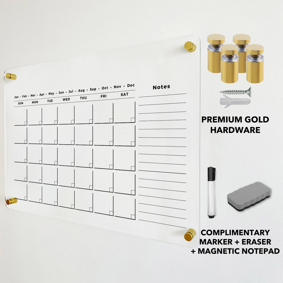 Monthly acrylic calendar with a long notes column, shown beside gold wall mounts and a dry-erase eraser.