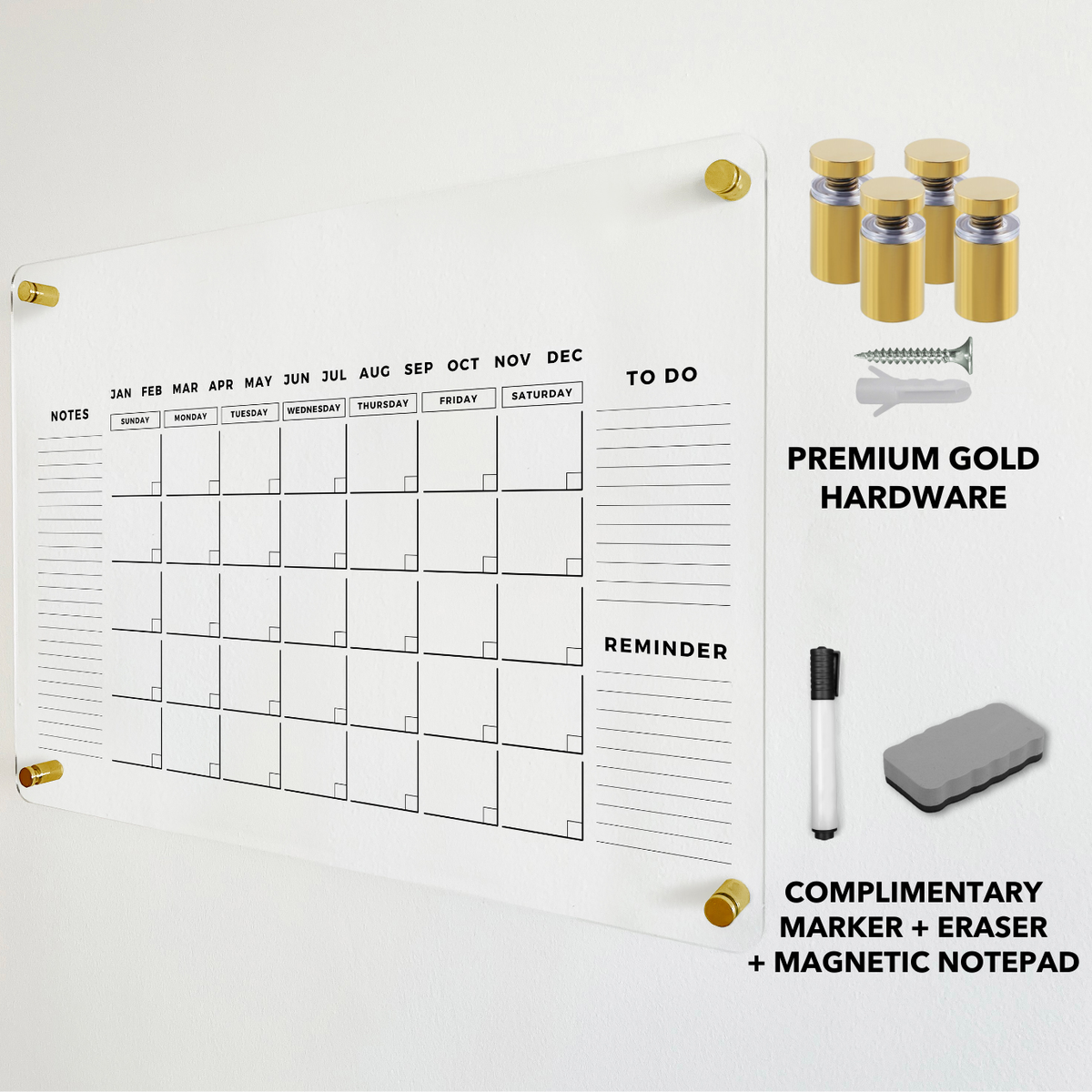 Acrylic monthly calendar with gold wall-mounting hardware and a dry-erase eraser shown alongside the board.