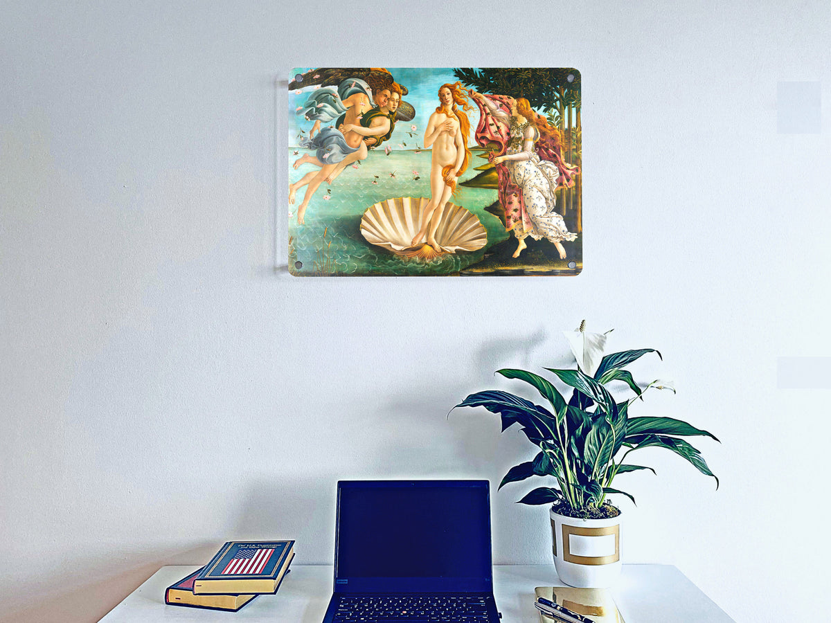 Personal photo printed on a wall-mounted acrylic panel above a desk, laptop and plant.