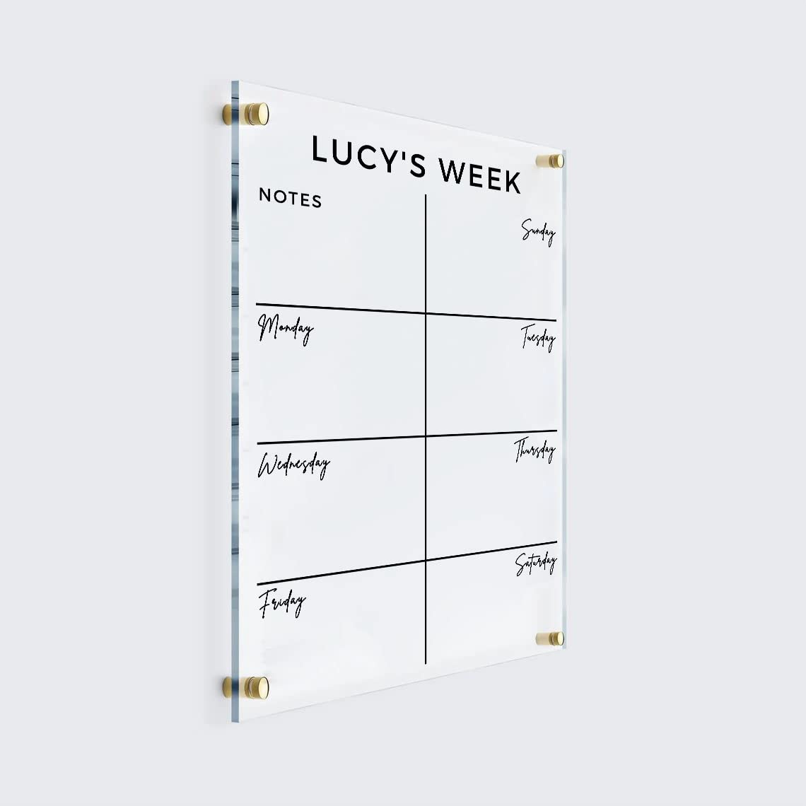 Personalized vertical acrylic weekly planner with seven daily spaces and a Notes box arranged in two columns, shown with gold mounts.