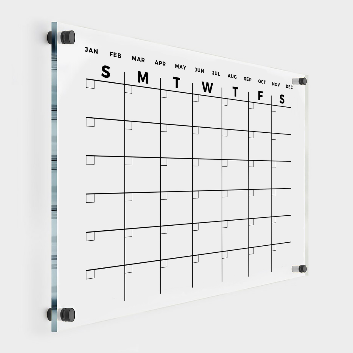 Minimalist clear acrylic monthly calendar with bold day initials, twelve month labels, small date boxes and black wall mounts.