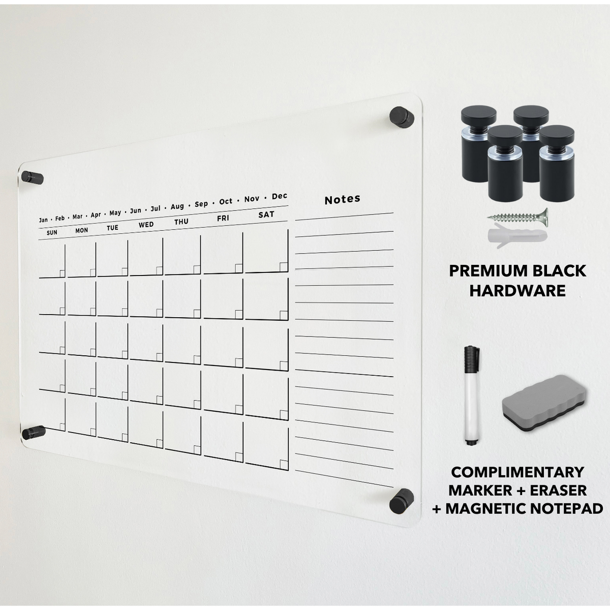 Monthly acrylic calendar with a long notes column, shown beside black wall mounts and a dry-erase eraser.