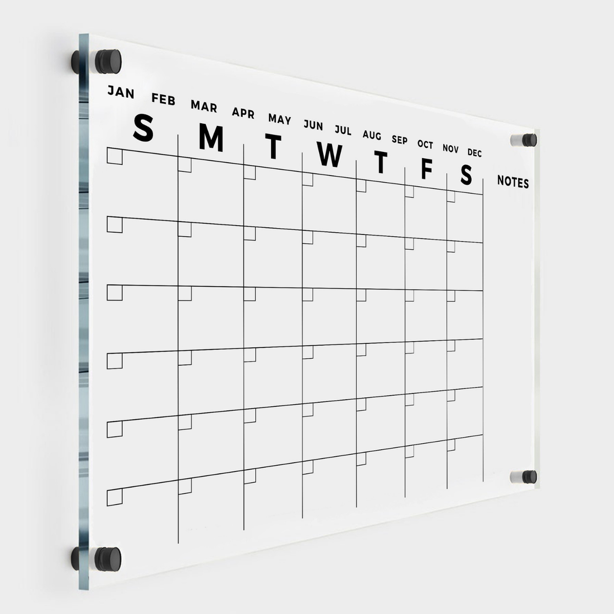 Clear acrylic monthly calendar with bold day initials, month labels, an unlined Notes column on the right and black wall mounts.
