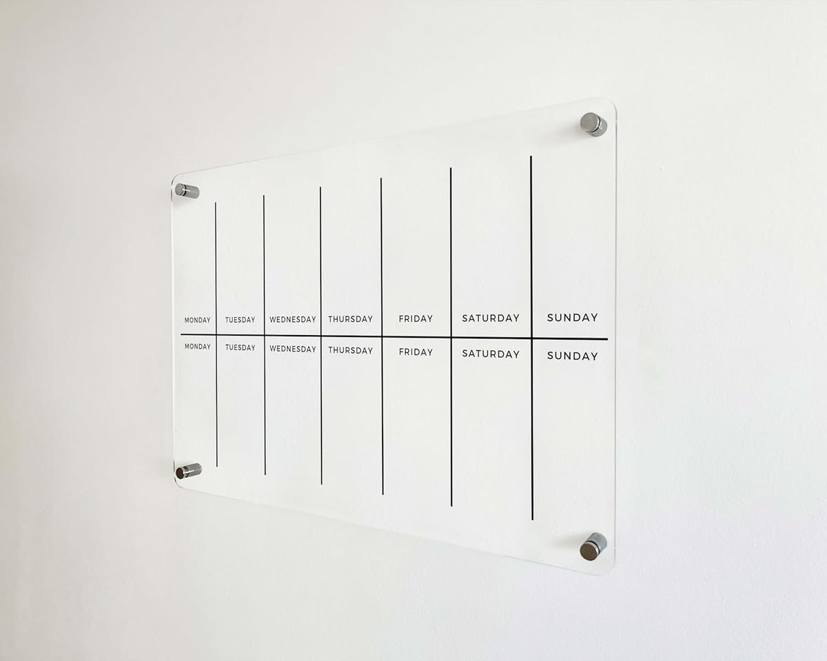 Front view of a clear acrylic two-week planner showing fourteen daily writing spaces and a central horizontal divider.