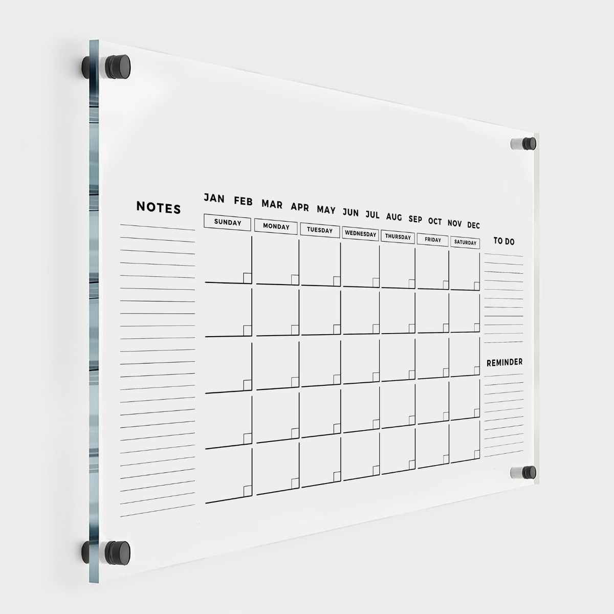 Clear acrylic monthly calendar with fixed Notes, To Do and Reminder sections, month labels above the grid and black wall mounts.