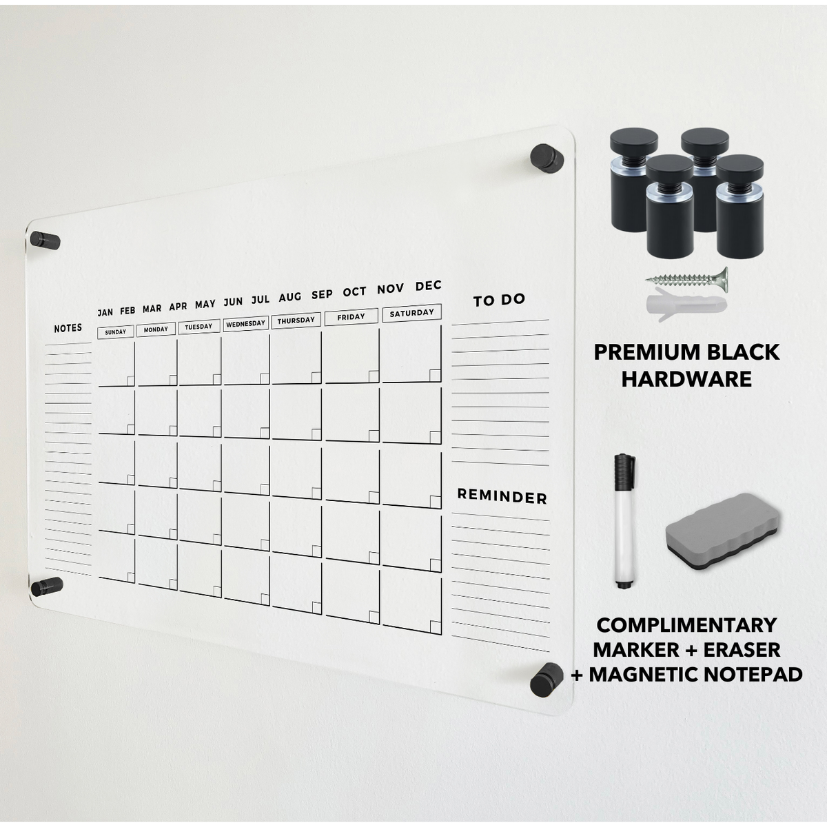 Acrylic monthly calendar with black wall-mounting hardware and a dry-erase eraser shown alongside the board.