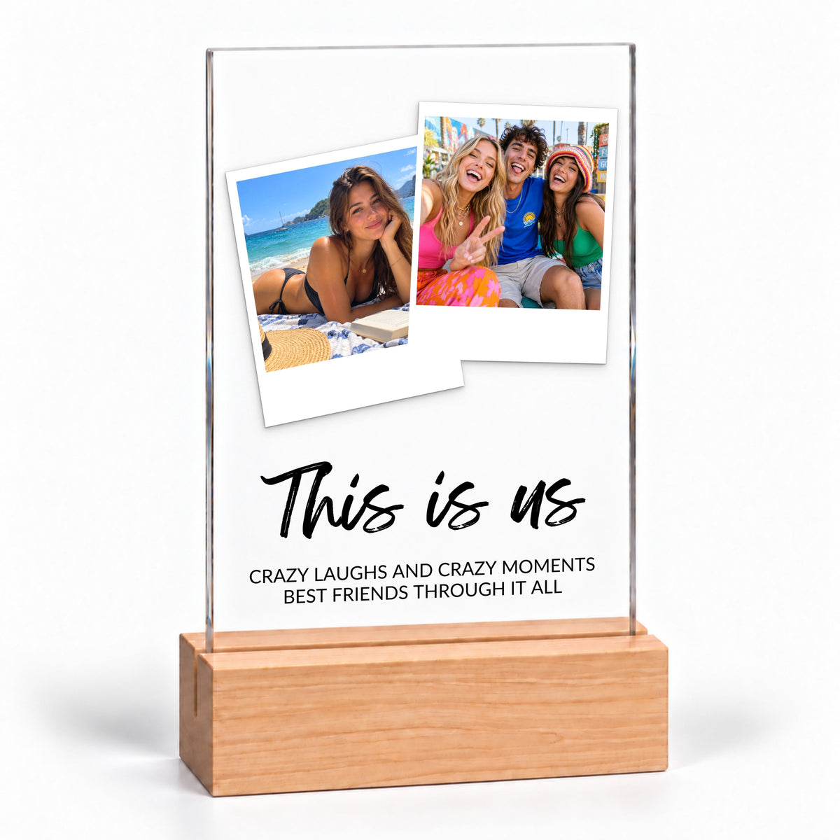 Clear acrylic Two Photo Collage Plaque - Brush Script on a plain wooden stand with the sample text This is us, on white