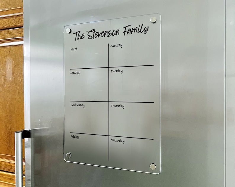 Magnetic acrylic fridge board with a spacious weekday boxes and a notes section in a vertical layout.