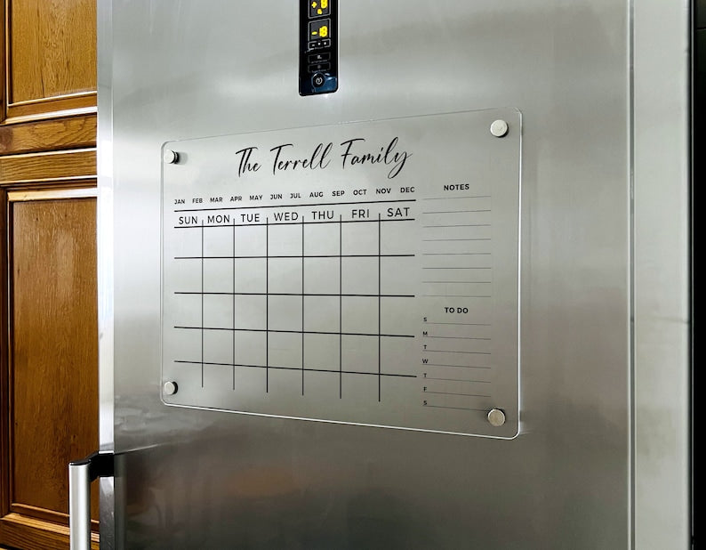 Magnetic acrylic fridge board with a monthly grid with notes and to-do sections on the right.