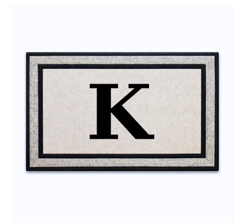 18 x 30 inch polyester doormat featuring a bold single initial.