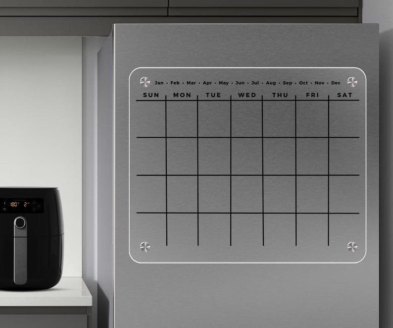 Magnetic acrylic fridge board with a monthly grid with rounded corners and no custom text.